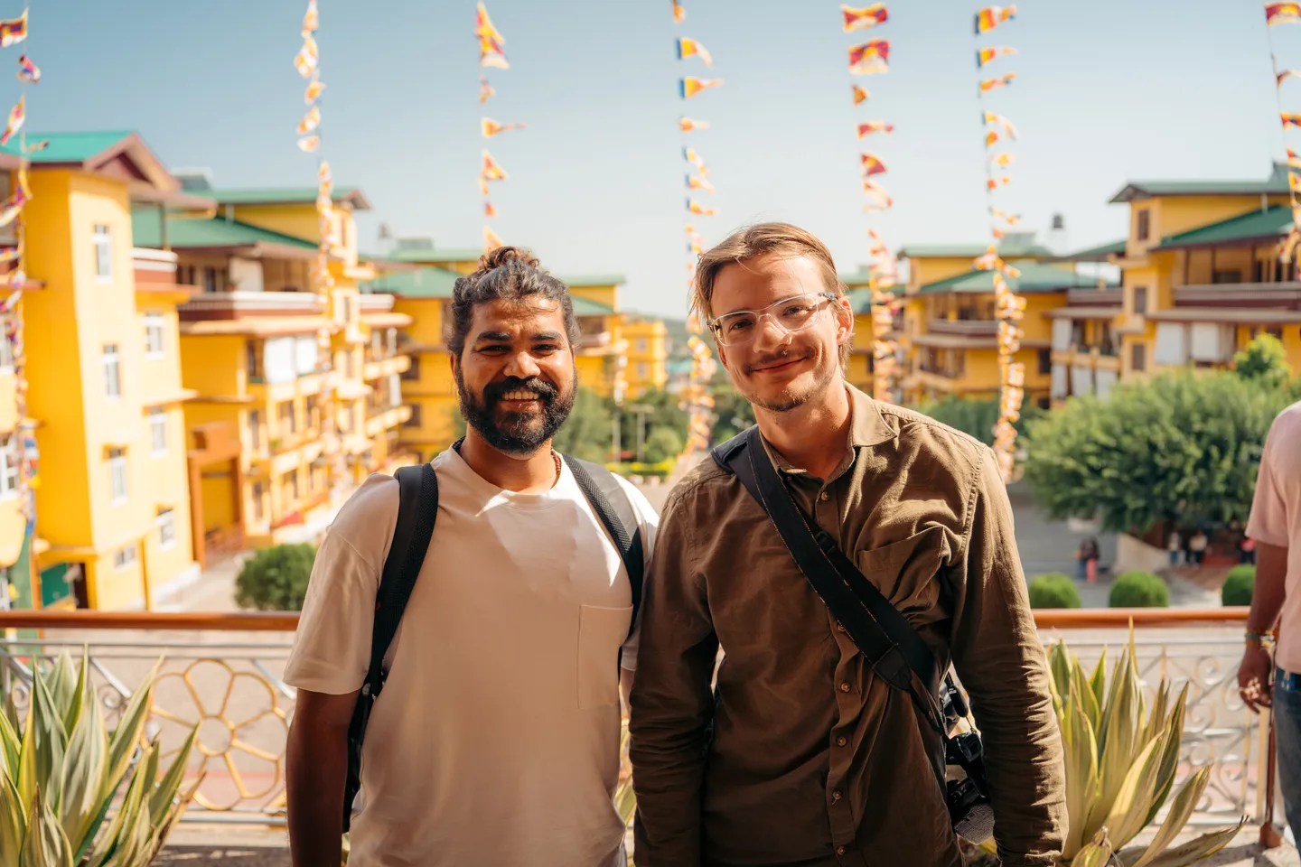 Ashish Sahani with TOTO Studio under prayer flags in Dharamshala